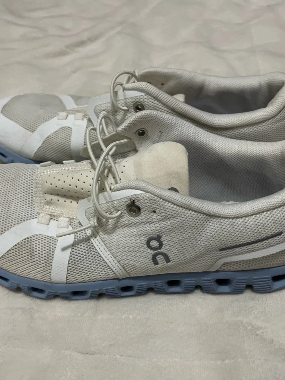 On Running Cloud Sneakers in White with Light Blue Sole